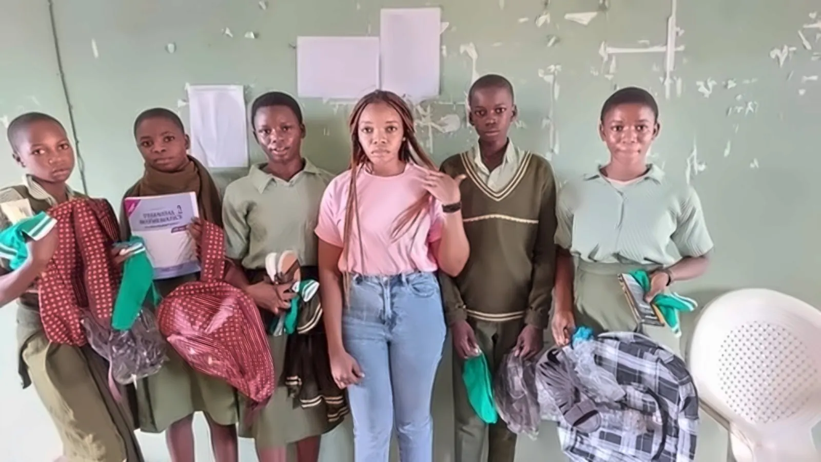 Students receiving new school bags
