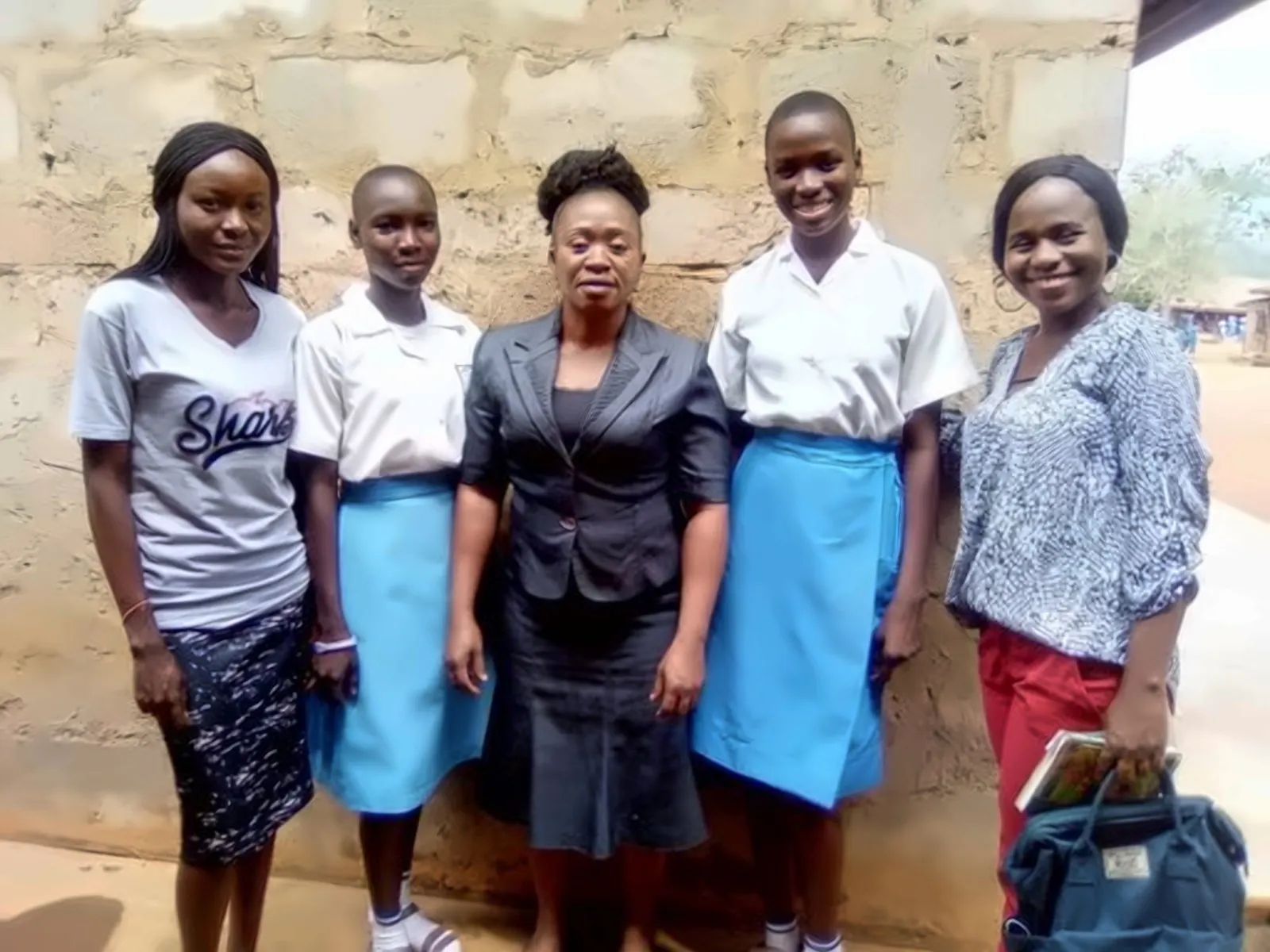 Foundation team members with students